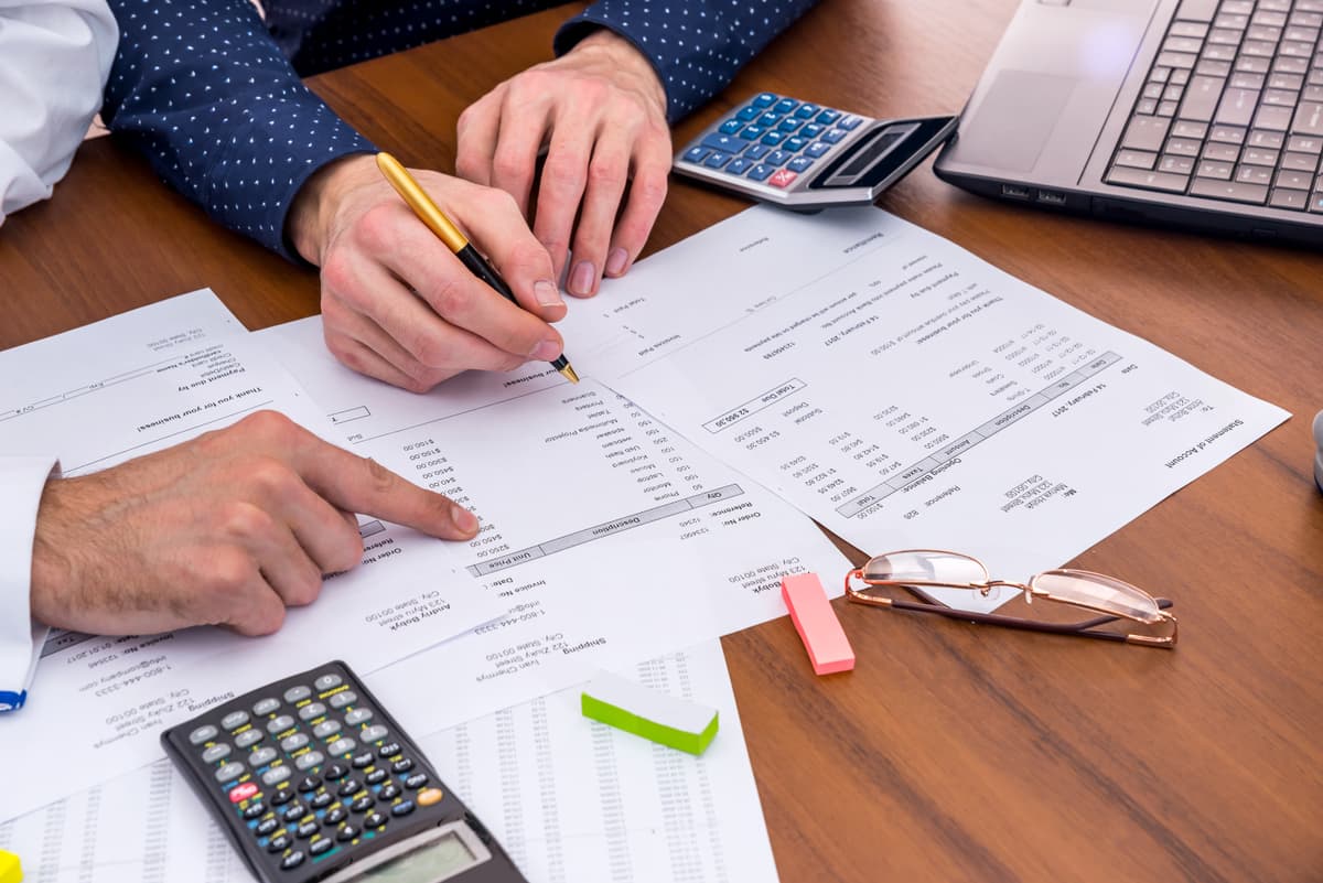 Team reviewing business expenses and budget analysis